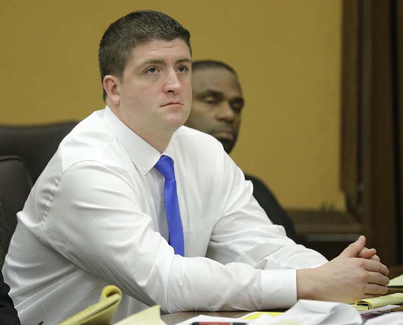 
              In a Monday, April 6, 2015 file photo, Cleveland police officer Michael Brelo listens to opening arguments in Cleveland in his trial on voluntary manslaughter charges  in the deaths of two unarmed motorists after a high-speed chase. The circumstances of a police shooting trial unfolding in a Cleveland courtroom share similarities to a high-speed chase and fatal shooting in Tennessee as well as the matters of law on which the Cleveland case will be decided: When does a threat to officers’ lives end?  (AP Photo/Tony Dejak, Pool, File)
            