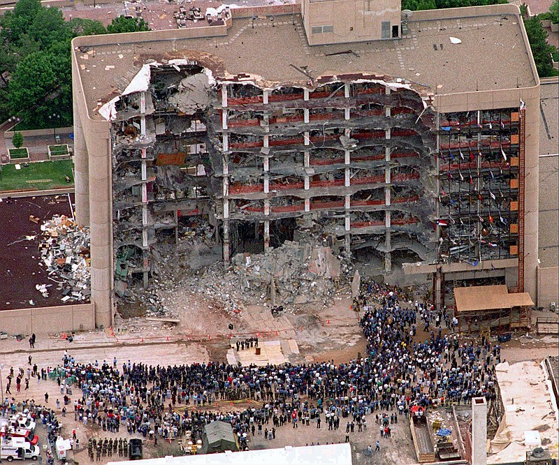 
              FILE - In this May 5, 1995 file photo, a large group of search and rescue crew attends a memorial service in front of the Alfred P. Murrah Federal Building in Oklahoma City. The blast killed 168 people _ including 19 children _ injured hundreds more and caused hundreds of millions of dollars in damage to structures and vehicles in the downtown area. (AP Photo/Bill Waugh, Flle)
            