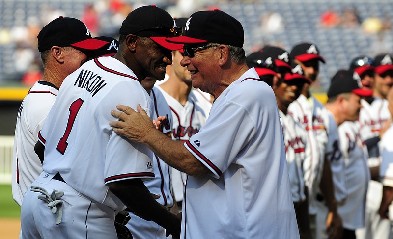 Former Atlanta Braves manager Bobby Cox, right, greets former player Otis Nixon for a Braves Legends Game featuring the 1991 Braves against all other Braves alumni, on Aug. 13, 2011, in Atlanta.