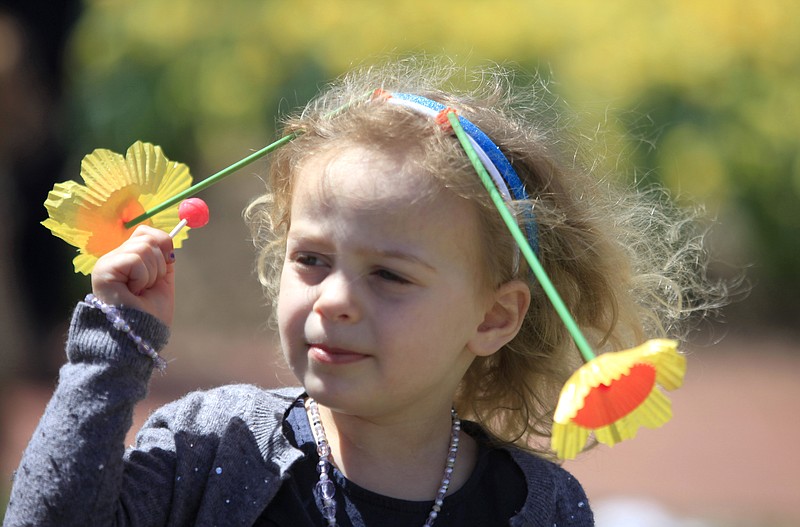 Abby Gerber, 3, of Ridgewood, enjoys the music at an Earth Day celebration at Memorial Park at Van Neste Square in Ridgewood, NJ., on Sunday, April 19, 2015.