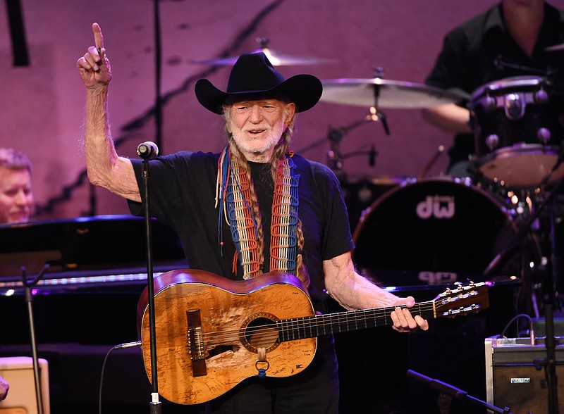 
              FILE - In this Feb. 5, 2015 file photo, Willie Nelson performs at the 17th Annual GRAMMY Foundation Legacy Concert at the Wilshire Ebell Theatre in Los Angeles. Nelson announced Monday, April 20, 2015, he plans to roll out his own brand of marijuana called ``Willie’s Reserve,’’ that will be grown and sold in Colorado and Washington, two states where recreational use of the drug is legal. (Photo by Chris Pizzello, file/Invision/AP)
            