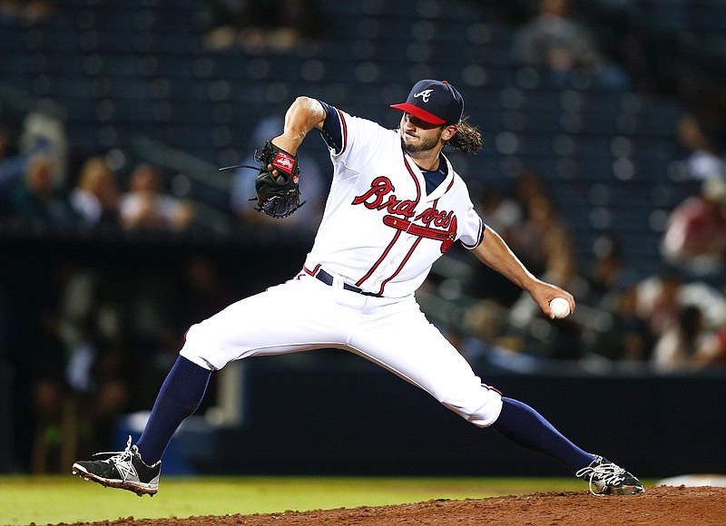 In this April 14, 2015, photo, Atlanta Braves relief pitcher Andrew McKirahan (52) delivers a pitch against the Miami Marlins during a baseball game, in Atlanta.