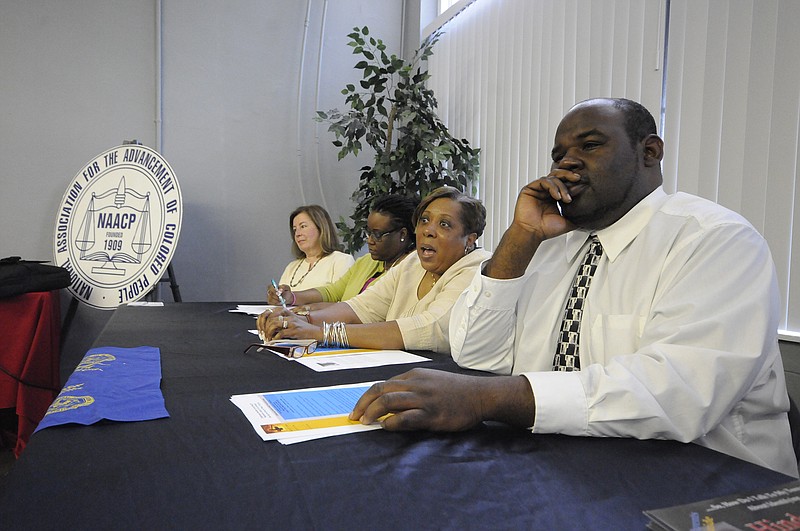 Jennifer Woods, second from right, offers comments on severing the school-to-prison pipeline during a discussion on restorative justice Tuesday at the Whiteside Building on M.L. King Boulevard. Woods was one of a panel of five consisting of, from left, Jennifer Paden, Lakweisha Ewing, Woods, Eric Adkins, right, and Richard Bennett, not pictured.