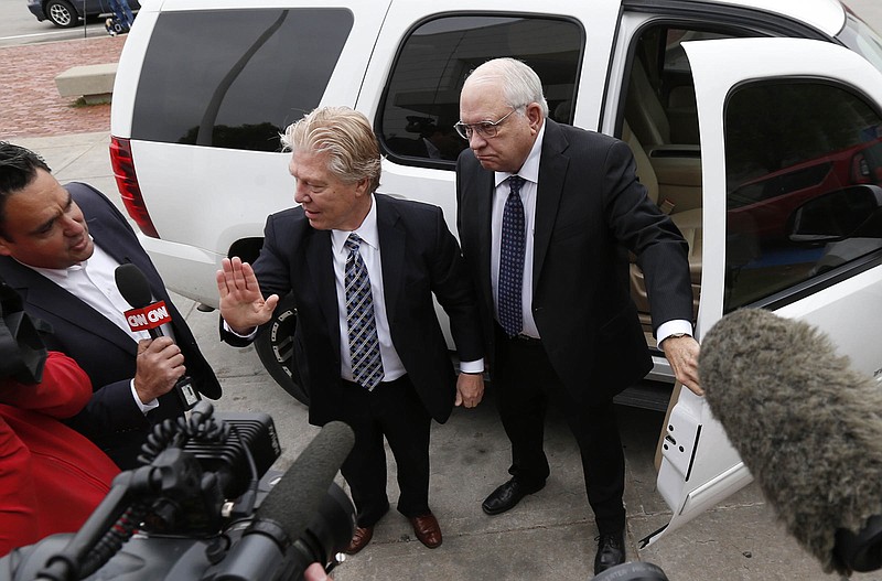 
              FILE - In this April 14, 2015 file photo, volunteer sheriff's deputy Robert Bates, right, arrives at the Tulsa County Jail with his attorney, Clark Brewster, in Tulsa, Okla. Bates,who killed an unarmed suspect in Tulsa, apologized for the shooting but described the confusion as a common problem in law enforcement. Experts agree that this is a real but very rare phenomenon that probably happens less than once a year nationwide. (Matt Barnard/Tulsa World via AP, File)
            