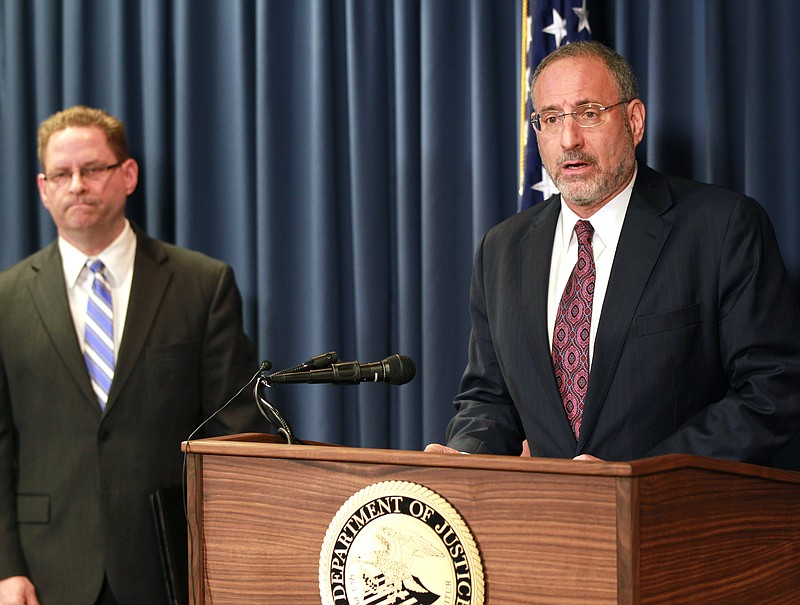 
              United States Attorney Andrew Luger, right, and FBI special agent Richard Thornton explain the criminal complaint charging six Minnesota men with terrorism at a news conference in Minneapolis, Monday April 20, 2015. The six, whom authorities described as friends who met secretly to plan their travels, are accused of conspiracy to provide material support and attempting to provide material support to a foreign terrorist organization. The complaint says the men planned to reach Syria by flying to nearby countries from Minneapolis, San Diego or New York City, and lied to federal investigators when they were stopped. (AP Photo/Andy Clayton-King)
            