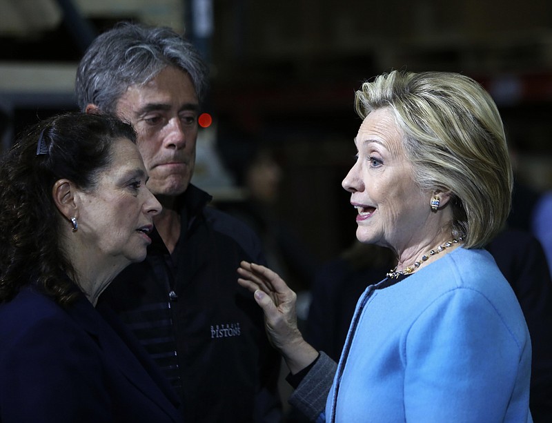 
              Democratic presidential candidate Hillary Rodham Clinton meets with employees at Whitney Brothers during a campaign stop, Monday, April 20, 2015, in Keene, N.H. (AP Photo/Jim Cole)
            