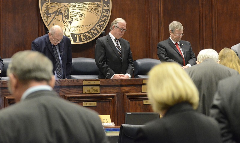 Hamilton County Commissioners pray before a meeting in this file photo.