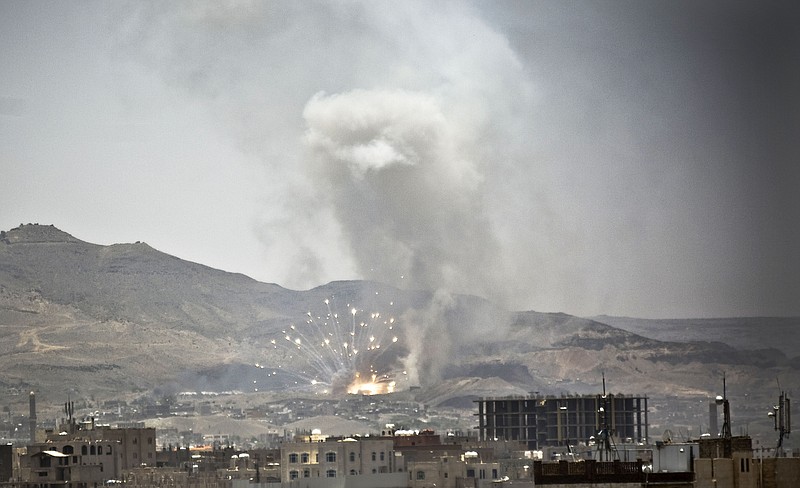 
              Smoke rises after a Saudi-led airstrike hit a site where many believe the largest weapons cache in Yemen's capital, Sanaa, on Tuesday, April 21, 2015. The Saudi-led coalition pounded Shiite rebels in Yemen on Tuesday, killing at least 19 in a city in the country's west, officials said. (AP Photo/Hani Mohammed)
            