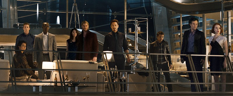 
              This photo provided by Disney/Marvel shows, from left, Cobie Smulders, seated, Chris Evans, Don Cheadle, Claudia Kim, Chris Hemsworth, Robert Downey Jr., Jeremy Renner, Mark Ruffalo and Scarlett Johansson in the film, "Avengers: Age Of Ultron." The movie releases in U.S. theaters on May 1, 2015. (Disney/Marvel via AP)
            