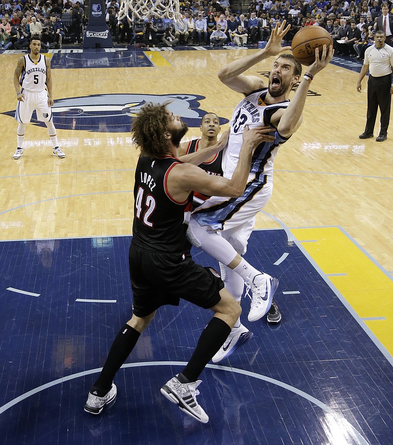 Memphis Grizzlies center Marc Gasol (33), of Spain, shoots against Portland Trail Blazers center Robin Lopez (42) in their Game 2 of an NBA basketball Western Conference playoff series Wednesday, April 22, 2015, in Memphis.