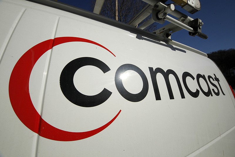 
              FILE - This Feb. 11, 2011 file photo shows the Comcast logo on one of the company's vehicles, in Pittsburgh. Wall Street appears increasingly convinced Comcast’s $45.2 billion purchase of Time Warner Cable is dead.  telling indicator is the gap between the value Comcast’s all-stock bid assigned to each Time Warner Cable share and Time Warner Cable stock’s current price. That was at its widest point yet Thursday, April 23, 2015, a signal that investors are giving just 20 to 30 percent odds that the deal will go through, said Nomura analyst Adam Ilkowitz. (AP Photo/Gene J. Puskar, File)
            