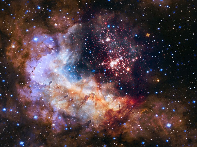 
              This undated photo provided by NASA shows an image taken by the Hubble Space Telescope showing a breeding ground for stars in the Constellation Carina, about 20,000 light years from Earth. Friday, April 24, 2015, marks the 25th anniversary of Hubble's launch. (NASA/ESA/Hubble Heritage Team/A. Nota, Westerlund 2 Science Team via AP)
            