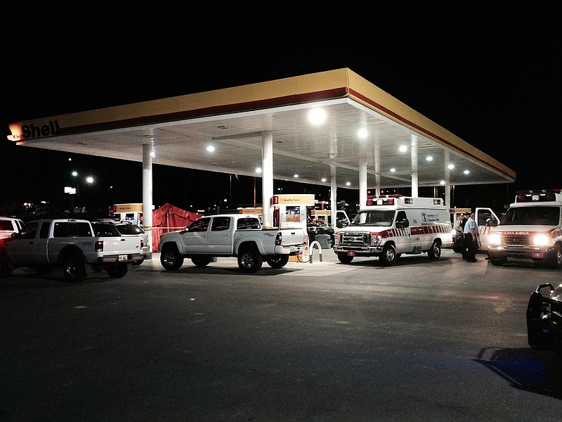 Officials work the scene after a killing in Whitfield County.