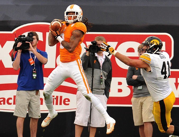 Tennessee's Von Pearson, left, pulls in a touchdown pass during the TaxSlayer Bowl in Jacksonville, Fla., in this Jan. 2, 2015, file photo.