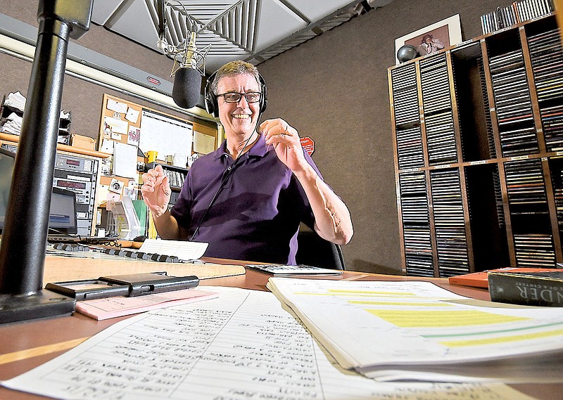 Richard Winham, longtime WUTC radio personality, does his afternoon spot at the NPR station on the campus of the University of Tennessee at Chattanooga on April 22, 2015. UTC is taking a look at the huge cost of running the station.