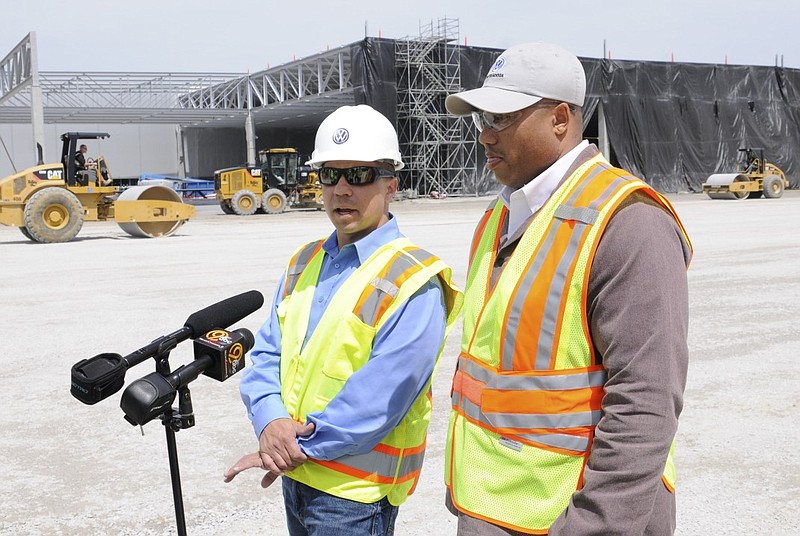 David Calfee, left, manager of construction planning, and Harry White, senior manager of Volkswagen's body shop, talk about the construction work that is well underway at the automaker's Chattanooga plant.