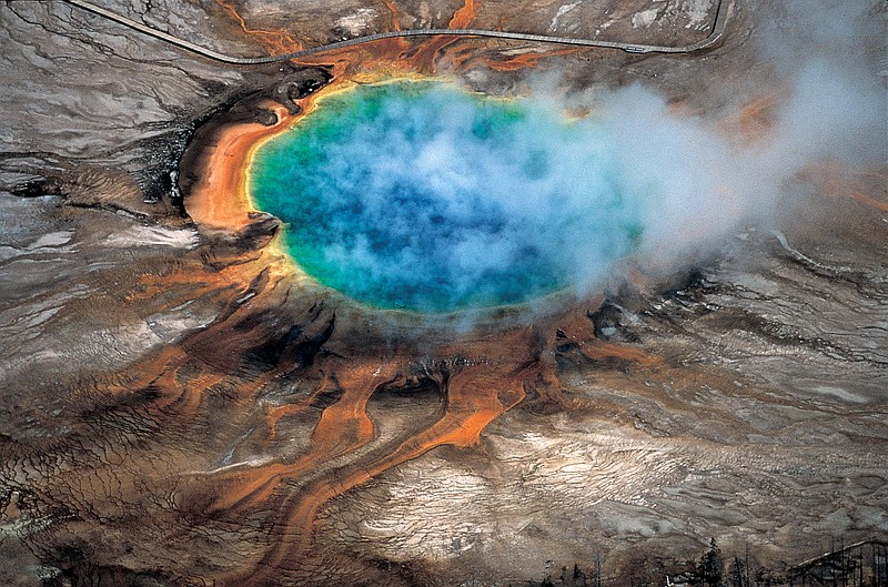 
              This undated photo provided by Robert B. Smith shows the Grand Prismatic hot spring in Yellowstone National Park's that is among the park's myriad hydrothermal features created by the fact that Yellowstone is a supervolcano, the largest type of volcano on Earth. Scientists have discovered a new, deeper reservoir of partly molten rock beneath the Yellowstone supervolcano. But they said the find doesn’t change the chances of a volcanic eruption. (Robert B. Smith via AP)
            