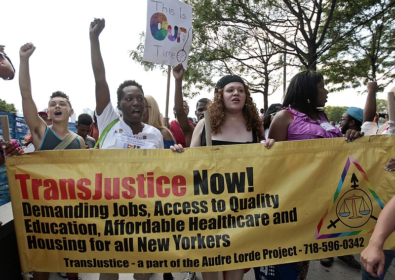 
              FILE - In this June 27, 2014 file photo people march during the 10th annual Trans Day of Action in New York.  Participants decried violence and discrimination while celebrating strides made by the lesbian, gay, bisexual and transgender communities. According to demographer Gary Gates of the UCLA School of Law's Williams Institute, an estimated 3.4 percent of American adults identify as lesbian, gay or bisexual, while only one-tenth that many — about 700,000 — are transgender. (AP Photo/Frank Franklin II, File)
            