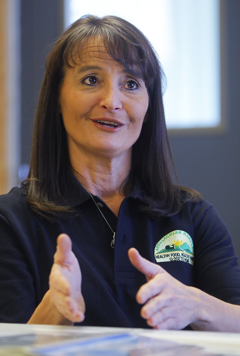 
              **HOLD FOR STORY BY JONATHAN DREW** Becky Robbins, general manager of the Appalachian Harvest facility speaks during an interview Friday, Feb. 6, 2015, in Duffield, Va. Appalachian Harvest has grown to a $1.5 million business that derives only a sliver of its budget from grants while delivering vegetables to grocers including Whole Foods, Ingles and Food City. The 15-year-old nonprofit is a standout success in a distressed region where economic development efforts come and go.(AP Photo/Wade Payne)
            