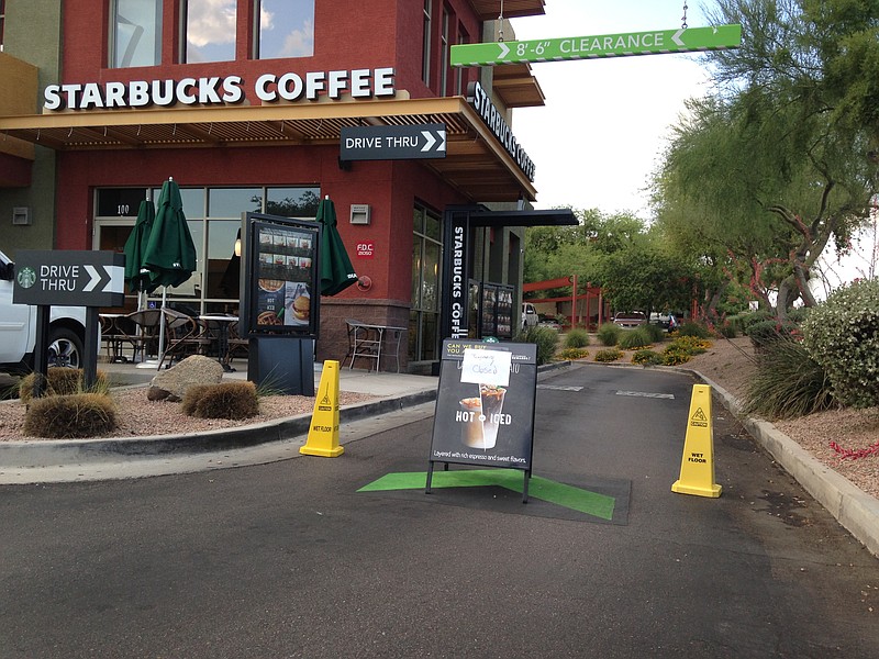 A Starbucks store closes Friday, April 24, 2015, in Phoenix because of computer issues. Starbucks says a sales register computer glitch has disrupted sales at company-operated stores in the United States and Canada.