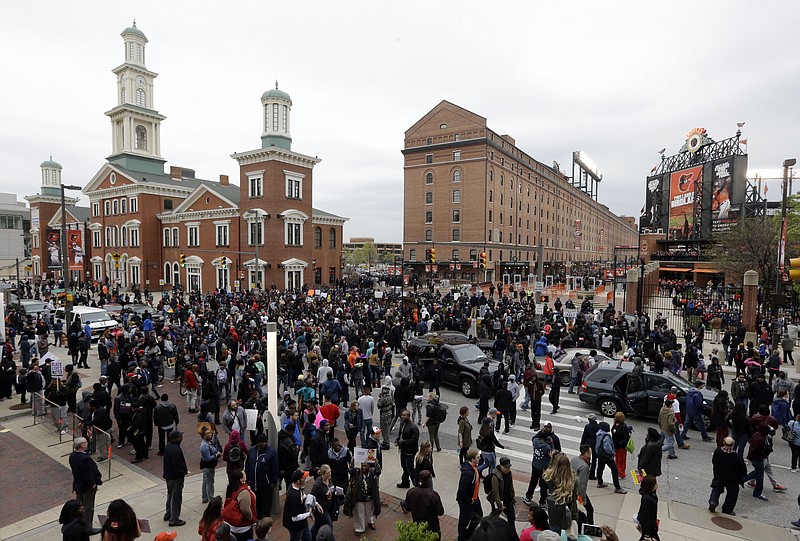 Protestors gather outside of Oriole Park at Camden Yards before the baseball game between the Boston Red Sox and the Baltimore Orioles after a rally for Freddie Gray, Saturday, April 25, 2015, in Baltimore. 