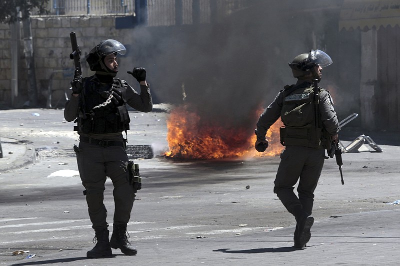 Israeli border police take up positions during clashes with Palestinians in this April 25, 2015, photo. 