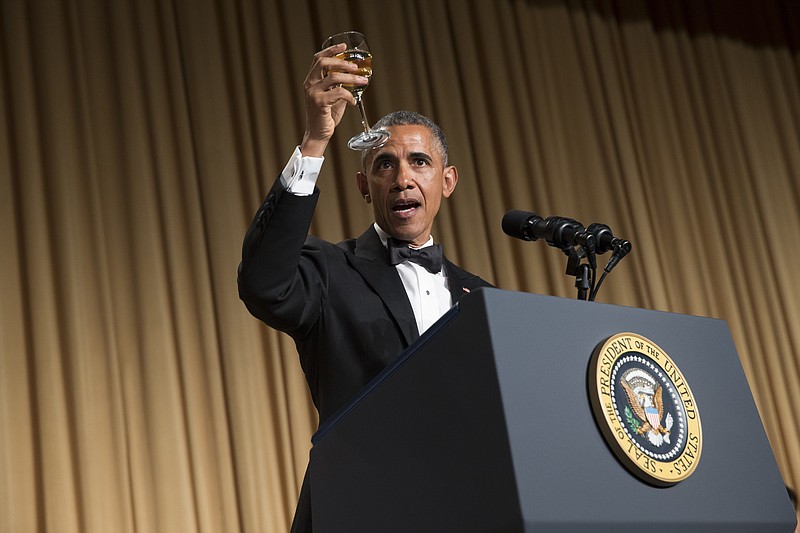 President Barack Obama offers a toast during the White House Correspondents' Association dinner at the Washington Hilton on Saturday, April 25, 2015, in Washington.