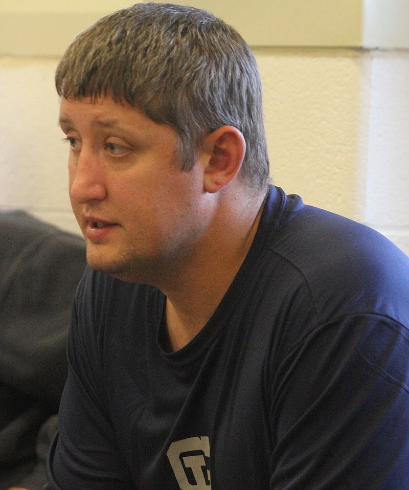 Coach Brent Raby talks to his team after a Gordon Lee High School wrestling practice at the high school in Chickamauga, Ga. 