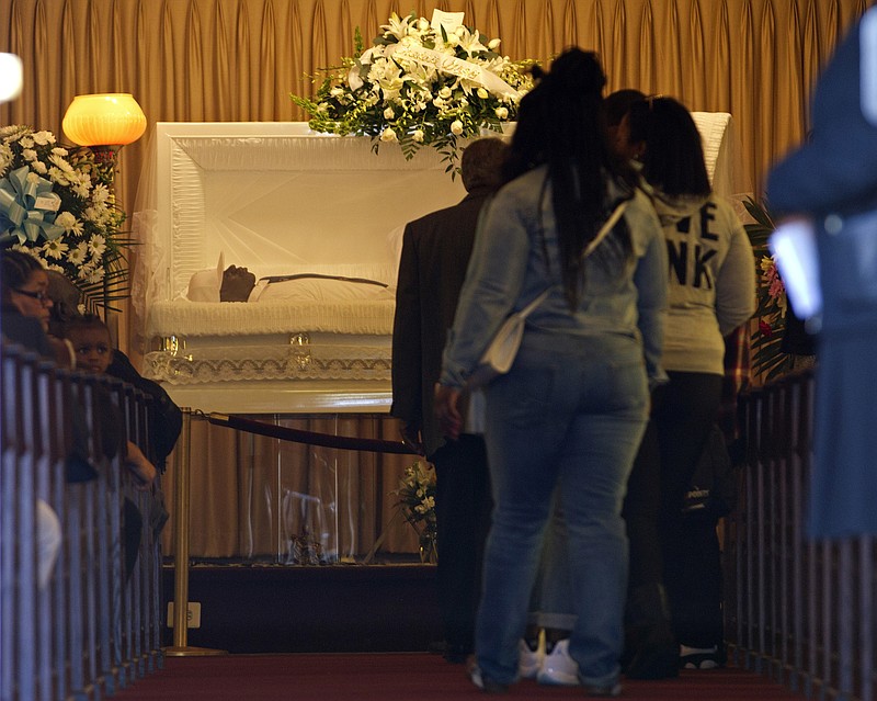 
              The body of Freddie Gray lies inside his casket at Vaughn Greene Funeral Home, during his wake Sunday, April 26, 2015 in Baltimore. Gray died from spinal injuries about a week after he was arrested and transported in a police van. (AP Photo/Jose Luis Magana)
            