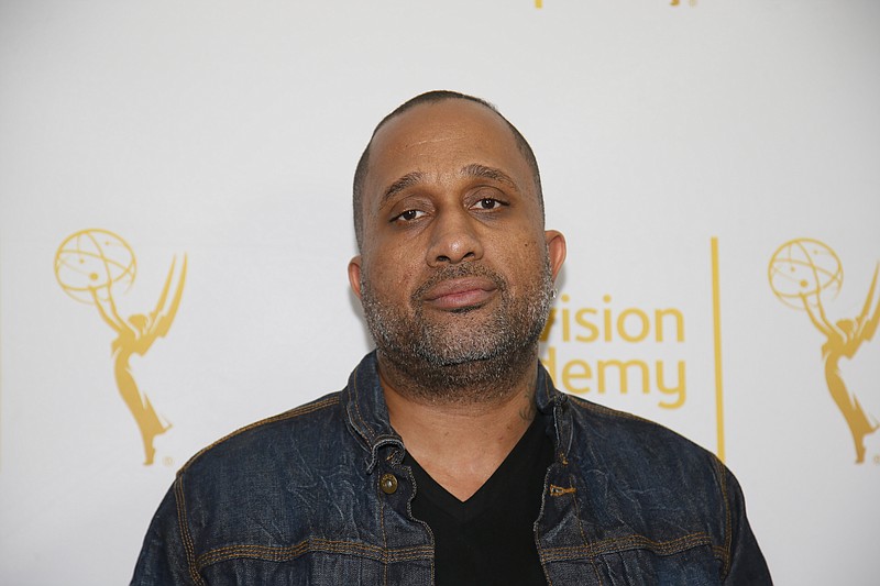 
              FILE - In this Jan. 28, 2015 file photo, Creator and Executive producer of "Black-ish," Kenya Barris, poses on the red carpet at "An Evening with Norman Lear," presented by the Television Academy at the Montalban Theatre in the Hollywood section of Los Angeles. Barris is set to write the screenplay for a "Good Times" film based on the hit '70s sitcom, his manager confirmed Monday, April 26, 2015, to The Associated Press. "Good Times," which aired on CBS from 1974 to 1979, was about an African-American family living in a poor neighborhood in Chicago. (Danny Moloshok/Television Academy via AP, File)
            