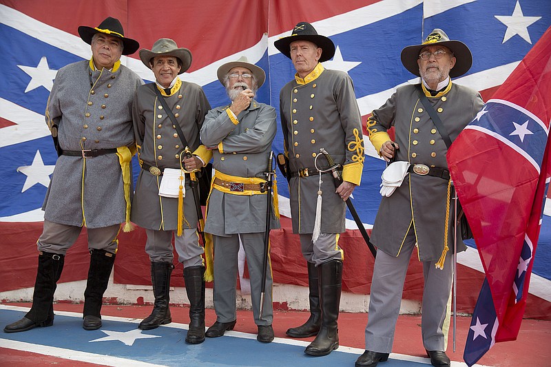 Descendants of American Southerners wearing Confederate-era uniforms pose for pictures as they attend a party to celebrate the 150th anniversary of the end of the American Civil War in Santa Barbara d'Oeste, Brazil, Sunday, April 26, 2015. For many of the residents of Santa Barbara d'Oeste and neighboring Americana, in Brazil's southeastern Sao Paulo state, having Confederate ancestry is a point of pride and is celebrated in high style at the annual "Festa dos Confederados, " or "Confederates Party" in Portuguese.