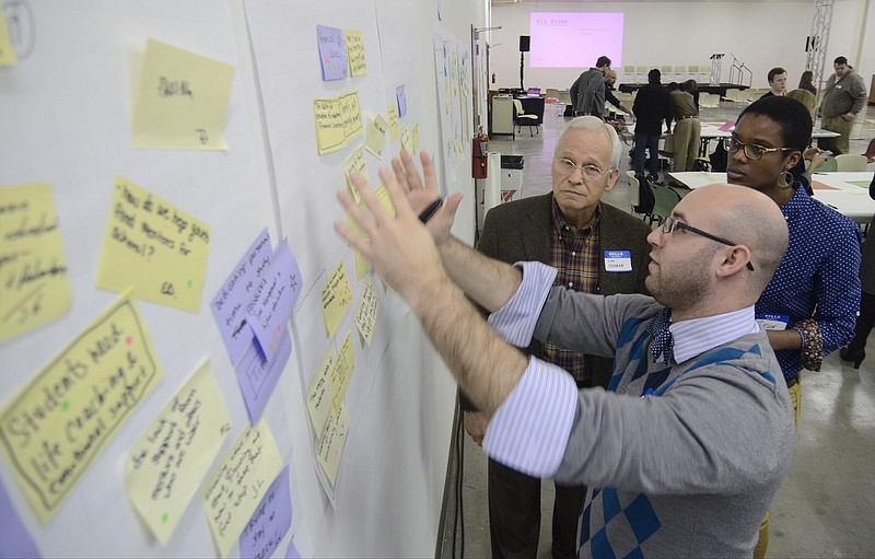 Justin Tirsun, center, Lou Kramer, left, and Seun Erinle participate in the Mozilla Gigabit Community Fund kickoff at the Chattanooga Public Library.