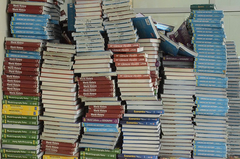 Textbooks are seen stacked in a hallway at East Hamilton Middle/High School in Chattanooga.