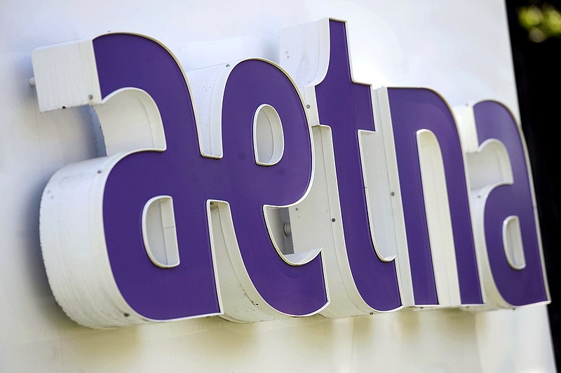 
              FILE - This Tuesday, Aug. 19, 2014 file photo shows signage in front of Aetna Inc.'s headquarters in in Hartford, Conn. Aetna Inc. reports quarterly financial results before the market opens Tuesday, April 27, 2015. (AP Photo/Jessica Hill, File)
            