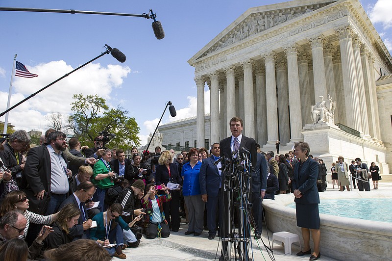 Washington attorney Douglas Hallward-Driemeier, speaks with reporters outside the Supreme Court in Washington, Tuesday, April 28, 2015, after arguing arguing that states must recognize same-sex marriages performed elsewhere before the court.