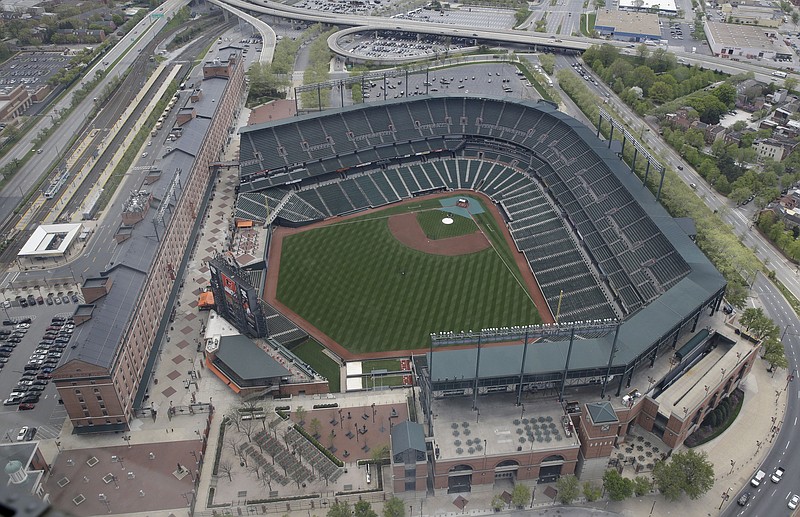 In this aerial photo, Oriole Park at Camden Yards sits empty Tuesday, April 28, 2015, in Baltimore as unrest that occurred after Freddie Gray's funeral continues into a second day.