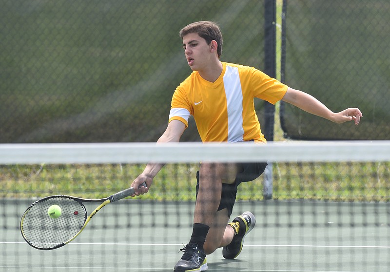 Hixson's Alex Condra returns a drop shot Wednesday, April 29, 2015, on his way to winning the District 6-A/AA singles championship 6-3, 6-3 over Red Bank's Daniel Cox at the Brainerd Recreation Center courts next to Brainerd High School.