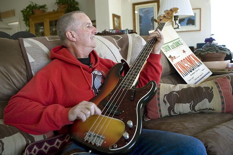 
              FILE - In this April 16, 2009, file photo, Jack Ely, co-founder of the early 60's band The Kingsmen and best known for his 1963 rendition of the song "Louie, Louie", plays his Fender bass guitar at his home in Terre Bonne, Ore. Ely has died after a long battle with an illness, his son, Sean Ely, confirmed Tuesday, April 28, 2015. He was 71. (AP Photo/Don Ryan, File)
            