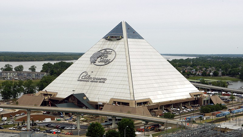 
              In this April 27, 2015 photo, the new Bass Pro Shop store stands near the Mississippi River in Memphis, Tenn. The store, which opens April 29, is in the Memphis landmark known as the Pyramid. Bass Pro and the city agreed on a 55-year-lease in 2010, and construction to convert the 535,000-square foot building from arena to megastore began four years ago. (AP Photo/Karen Pulfer Focht)
            