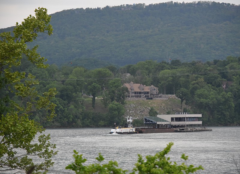The Casey barge rounds Moccasin Bend on the Tennessee River late Thursday, April 30, 2015, near the base of Lookout Mountain, in this view from Interstate 24.