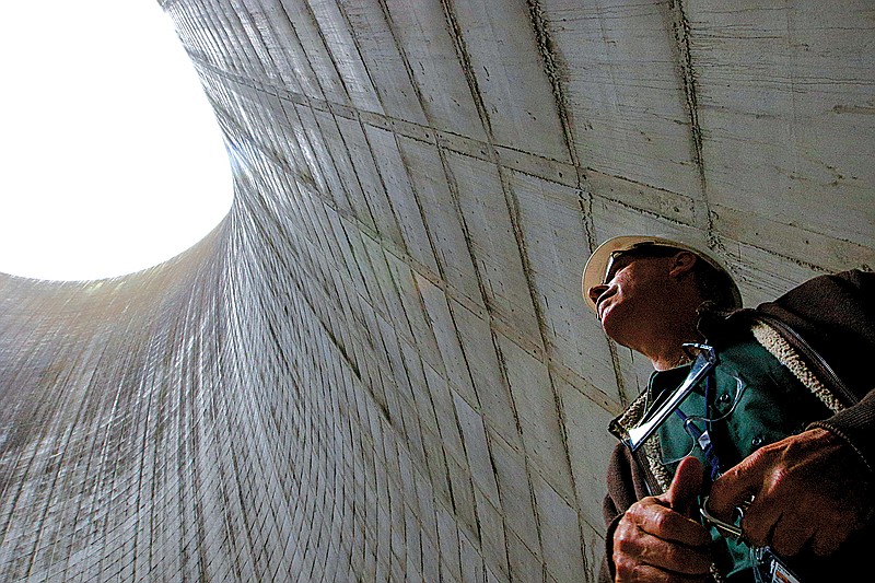 Unit 2 senior manager of operations Tom Wallace stands inside the Unit 2 cooling tower of TVA's Watts Bar nuclear plant. 