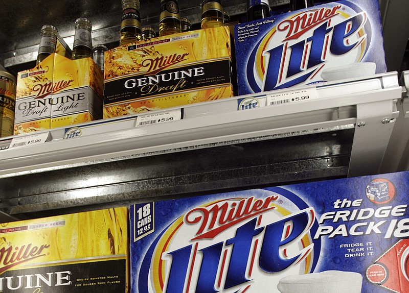 Miller Lite and genuine draft packages chill in a cooler in a store in this file photo.