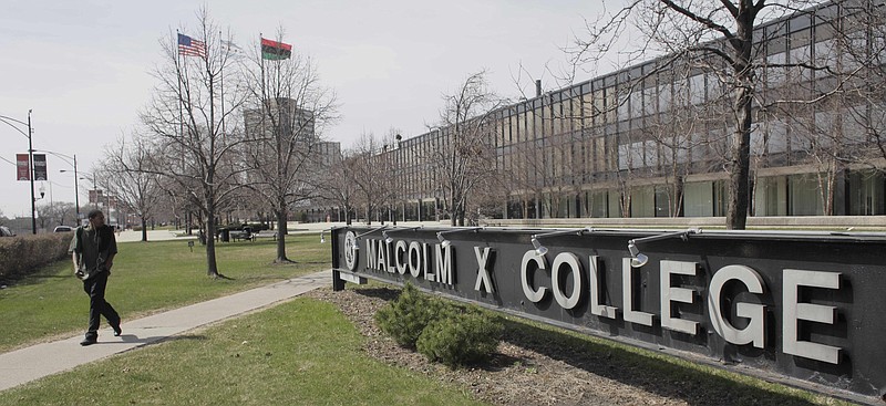 
              FILE - This April 1, 2010 file photo shows Malcom X College in Chicago. A doctor has filed a lawsuit against City Colleges of Chicago, claiming he was fired in retaliation for raising questions about four unidentified, decomposing cadavers stored in boxes in a locked, un refrigerated closet. Dr. Micah Young filed the lawsuit Tuesday April 28, 2015 in Cook County Circuit Court. Young had been dean of the Health Sciences and Career Programs at Malcolm X College, one of seven colleges in the system. Young says he was fired Feb. 4 because he called attention to "severely decomposed cadavers" that weren't properly identified and might cause workplace safety issues. He says the bodies had been stored at least 12 years. (AP Photo/M. Spencer Green, File)
            