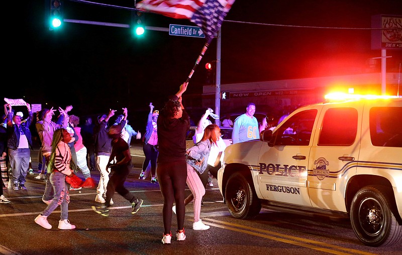 Protesters block the intersection of West Florissant Avenue and Canfield Drive in Ferguson, Mo., on April 28, 2015. (David Carson/St. Louis Post-Dispatch via AP)