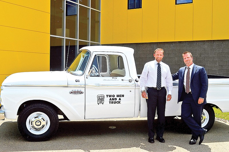 Brig Sorber, left, is CEO of Two Men and a Truck while his brother, Jon, is executive vice president. Their mother, Mary Ellen Sheets, created the company in 1985.