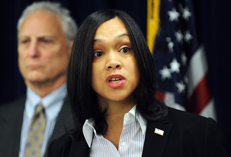 
              In this Feb. 3, 2015 photo, Marilyn Mosby, right, Baltimore City State’s Attorney, holds a press conference regarding the Phylicia Barnes case. At left is Deputy Chief Michael Schatzow. Baltimore’s chief prosecutor is 35 years old, has been on the job for less than four months, and is about to take on the biggest challenge of her career  weighing the evidence against six police officers in the death of Freddie Gray and deciding whether they deserve to be criminally charged. (Algerina Perna/The Baltimore Sun via AP)
            