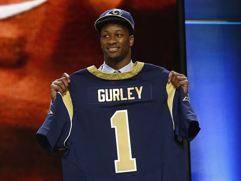 Georgia running back Todd Gurley poses for photos after being selected by the St. Louis Rams as the 10th pick in the first round of the 2015 NFL Draft, Thursday, April 30, 2015, in Chicago.