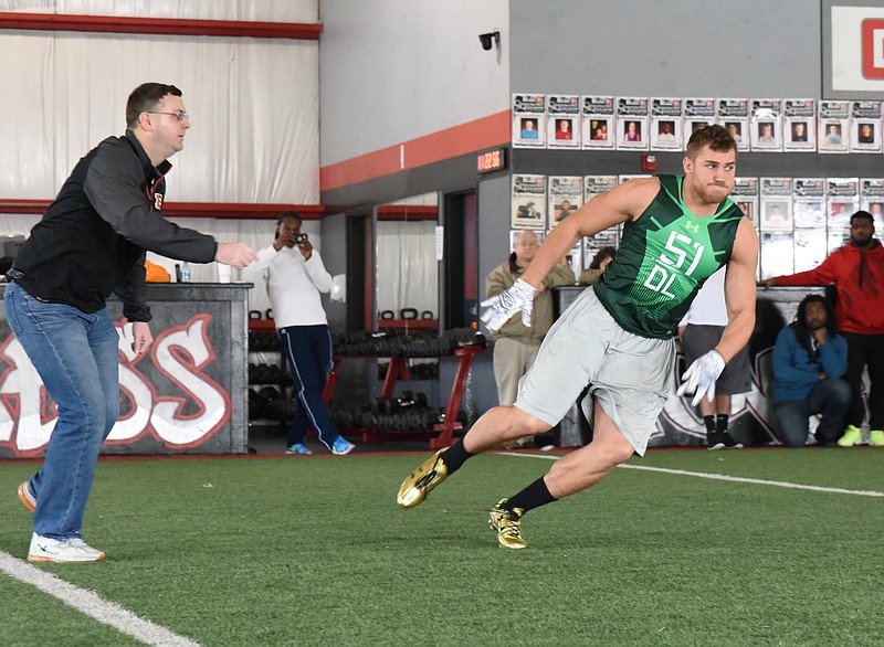 UTC's Davis Tull runs a directed route as NFL scouts watch during UTC's Pro Day on March 2, 2015.