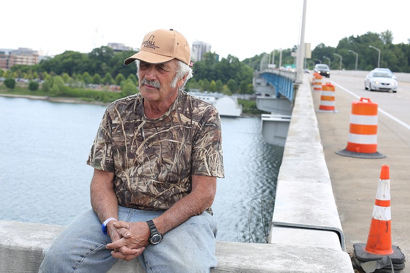 David Eck, better known as Captain Dave, sits on the Oligati Bridge over looking the barge as he waits for its departure on April 30, 2015 in Chattanooga.
