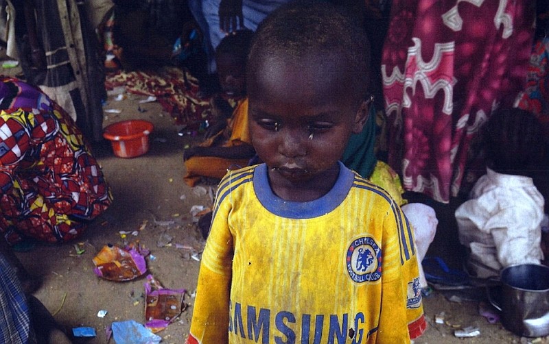 This photo made available by the Nigerian Military taken April 30, 2015, shows a Nigerian child that was allegedly rescued by the Nigerian Military after being taken by Islamic extremists in Sambisa Forest, Nigeria. 